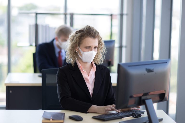 Woman With mask On in Office